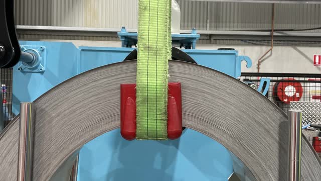 <p>Place two red corners on the inside of the top (on both sides) of new coil and make sure the sling is centred and straight. (You must be signed off to use the crane)</p>