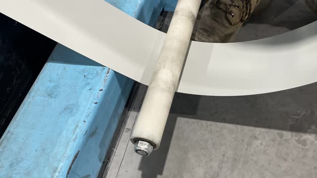 <p>Make sure the coil goes underneath the wheel, grey side facing up.</p>