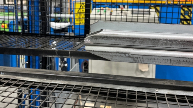 <p>Cut the end of the coil into this shape to help it through the guillotine.</p>