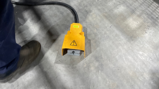 <p>Using the foot pedal at the back of the machine, jog the coil through the machine.</p>