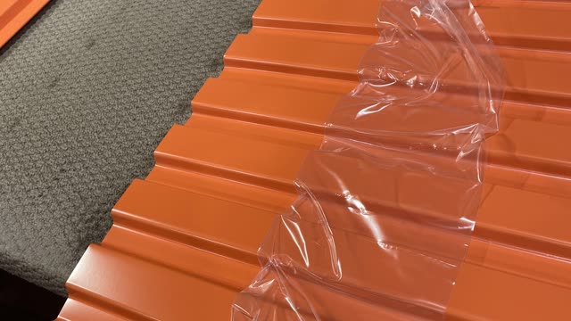 <p>Peel the plastic off the edges on the 2nd and 3rd sheet (4th as well if its a 4 sheeter door) on both ends. move sheets to seamer.</p>