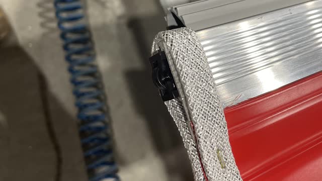 <p>Loop the braid around the end of the roller door (make sure to move the rubber out of the way) then staple [both sides]</p>
