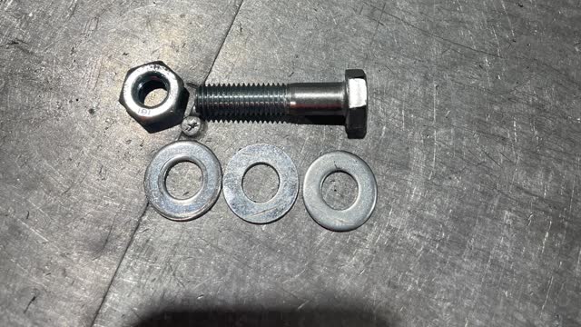 <p>To secure the spring to the wheel you will need: 3 washers, 1 bolt and 1 nut.</p>