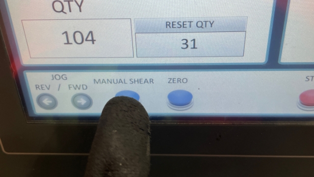 <p>Once the sheet is through, run it to a reasonable length the press the blue manual shear button to cut it.</p>