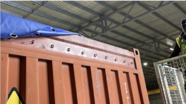 <p>Unhook the tarp, leaving one side attached.</p>

