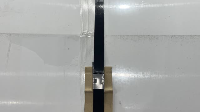 <p>Using the grinder remove metal strap and tape. Make sure to hold the end of the coil so it doesn’t hit you.</p>