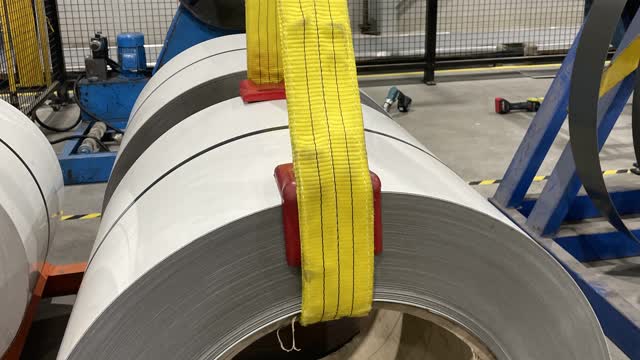 <p>Place red corners and sling on the new coil, make sure sling isnt twisted.</p>
