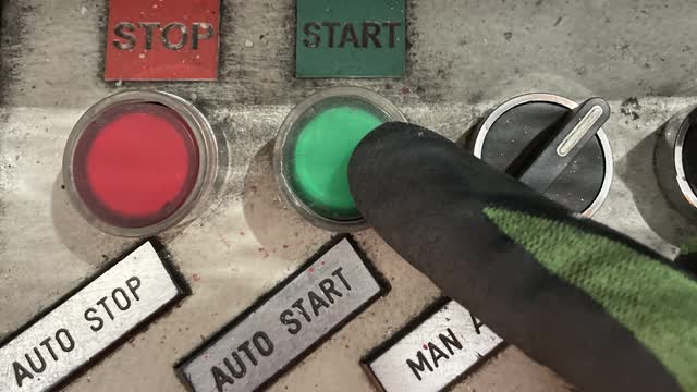 <p>Press the green Start button located on the console.</p>