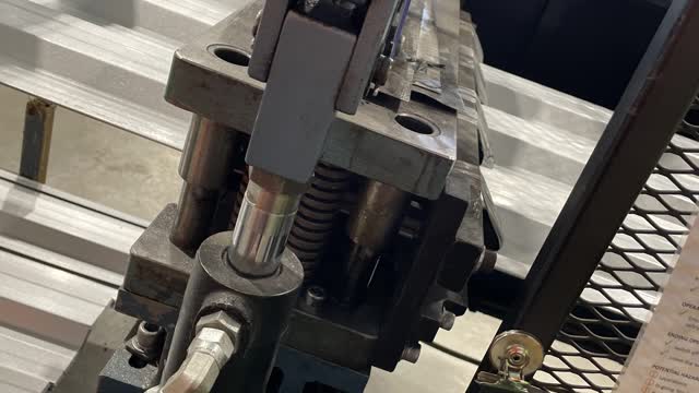 <p>Carefully jog the material through the guillotine.</p>