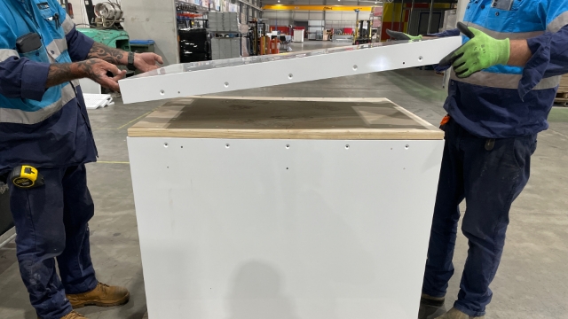 <p>Select the metal shelf and place on top of the timber support shelf.</p>
