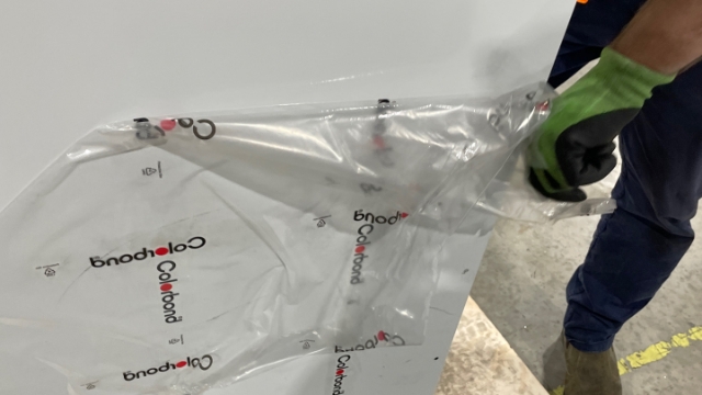 <p>Peel the plastic off of the base panel.</p>