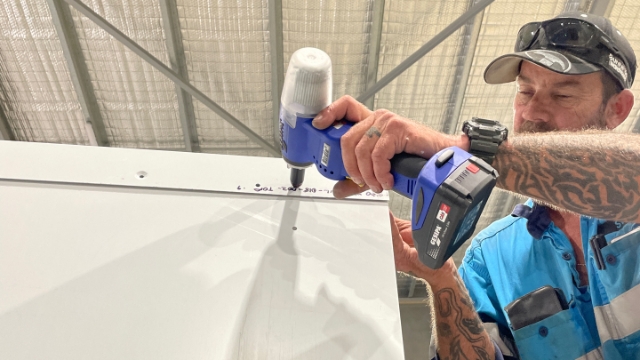 <p>There is no timber support for the roof, so you will have to lift slightly to align the rivet holes, repeat on both sides.</p>