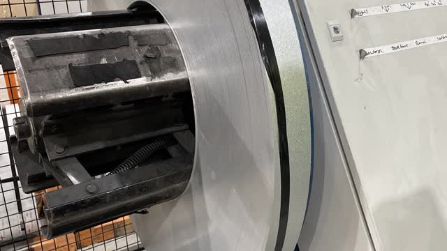<p>Remove tape or metal strap to find the end of the coil. (Be careful the coil does not fling out and hit you.)</p>