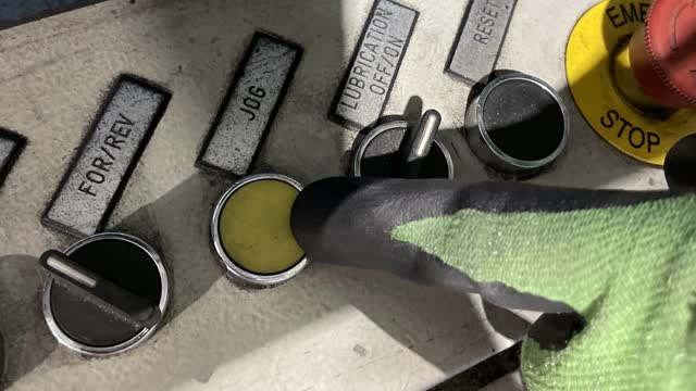 <p>Press the yellow Jog button to jog the material through the machine.</p>