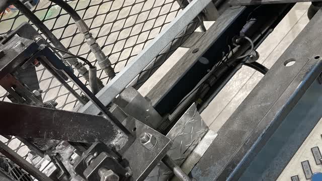 <p>Removing remaining material from the machine.</p>