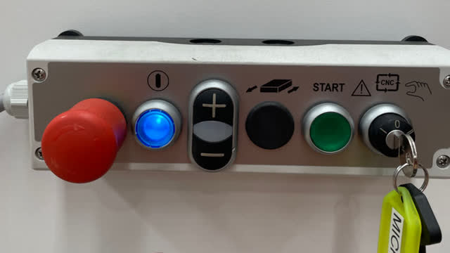 <p>Press the blue power button to energise the machine</p>