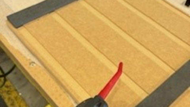 <p>Blow down the jig to ensure no swarf or shavings are present. This needs to be done for every panel.</p>