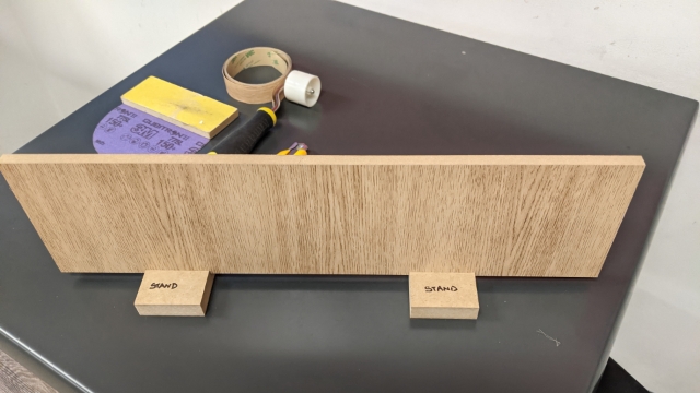 <p>Place panel in stand, make stands out of 18mm MDF with a 12mm grove.</p>
