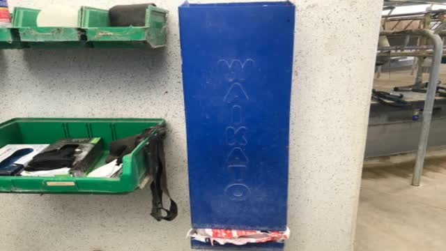 <p>Filter socks are on wall beside gloves</p>