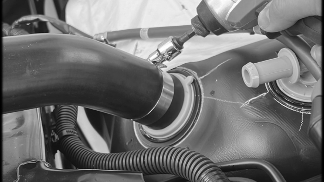 <p>Remove the existing fuel filler pipe that come</p>
<p>attached to the vehicle.</p>
<p>Place a large hose clamp over provided Fuel Filler Pipe. Install the pipe to the fuel tank as shown.</p>
<p>Tighten the hose clamp to ensure a secure connection.</p>