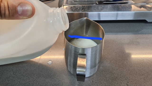 <p>Fill milk jug up to blue line</p><p><em>This is enough milk for a standard flat white in a standard coffee cup</em></p>
