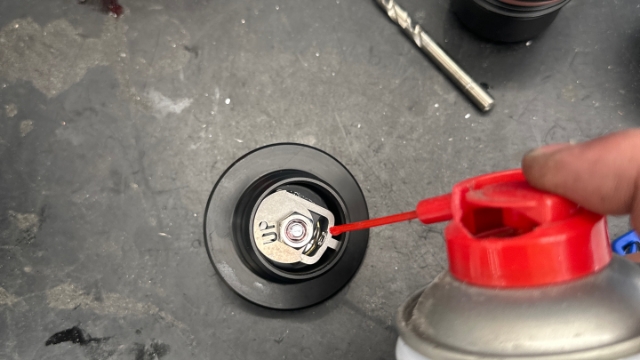 <p>Spray a little bit of lubricant into mechanism</p>