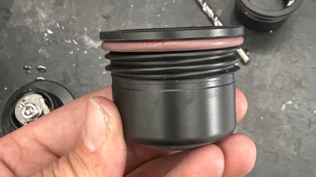 <p>Place fuel cap O-ring over the bottom half of the fuel cap</p>