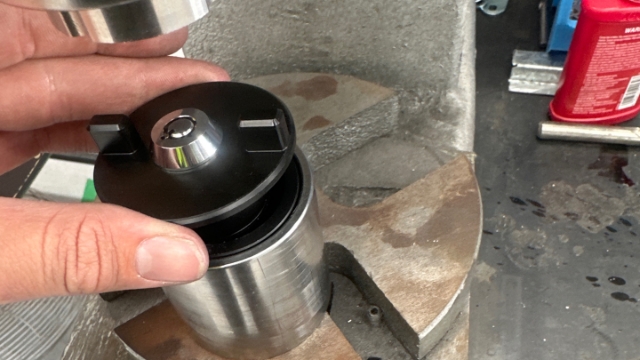 <p>Place top half of fuel cap into bottom half of fuel cap</p>