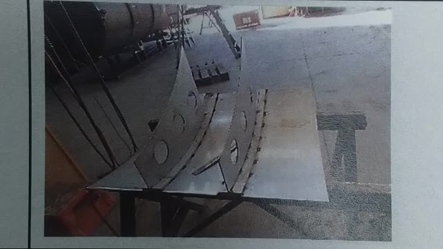 <p>Tack baffels onto rolled flatbar making sure that the baffels are flush with the top edge of the cyclone panel</p>