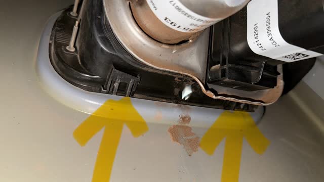 <p>Push tabs from the back side of the fuel door. This will allow the plastic to pop outward</p>